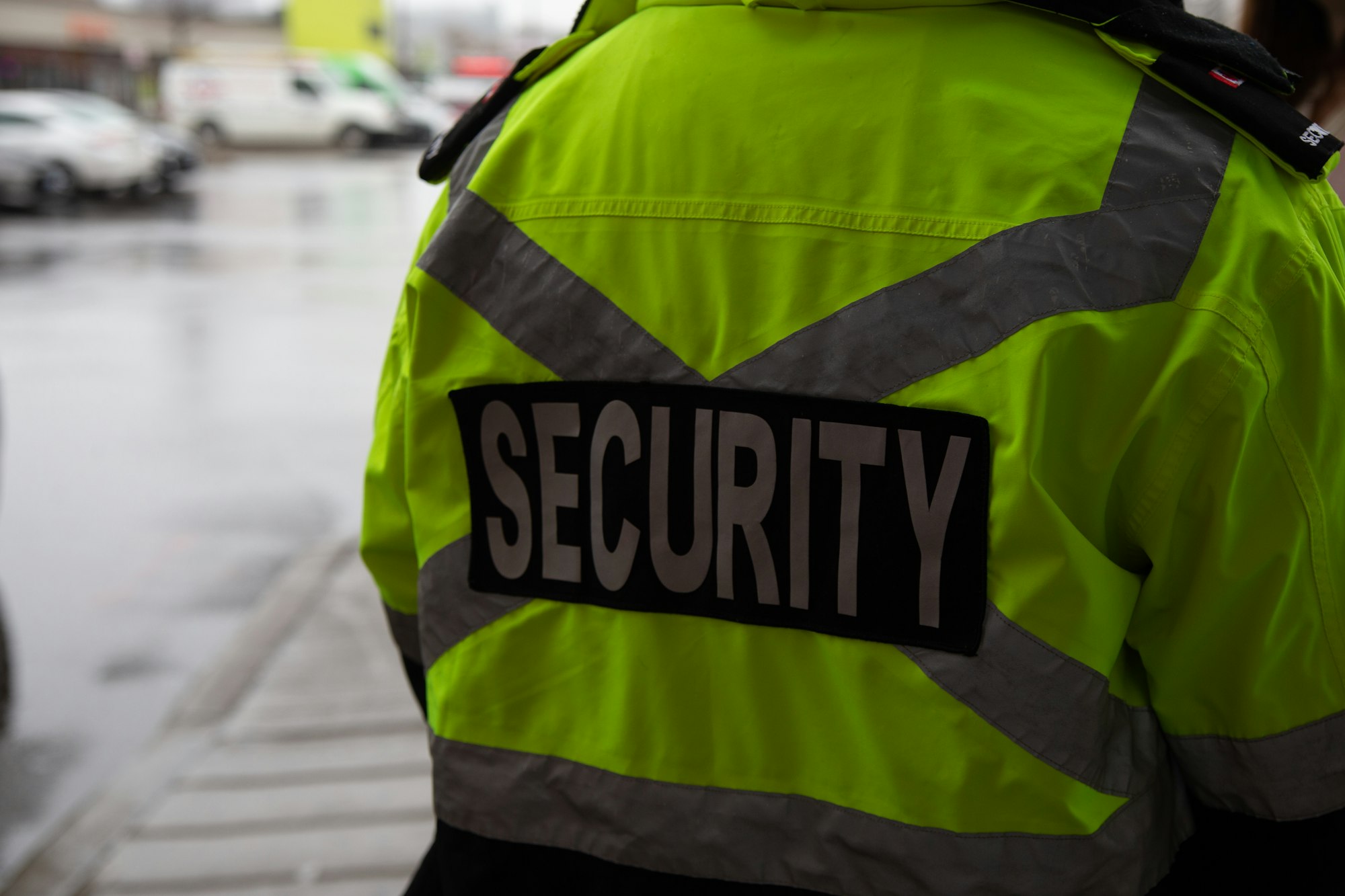 Closeup shot of a security guard watching over the parking area